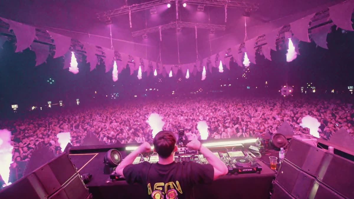 Satirized playing to a packed festival crowd under CO2 jets